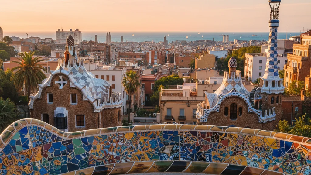 Park Güell's colorful mosaic serpent bench overlooking Barcelona's terracotta rooftops and Mediterranean coastline.