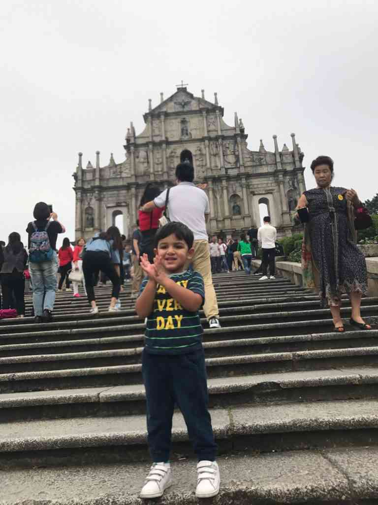 Aarav posing in front of the ruins of St. Paul in Macau's Historic Center